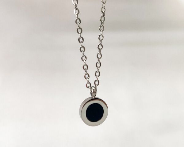 steel pendant on a chain